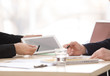 © New Africa - Business trainer and client working in office, closeup