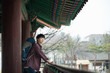 © Dialogue Frame - A young man doing a backpacking trip in a Korean traditional house.