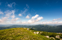 Beautiful Mountainous Landscape In Summer. Lovely Nature Scenery Observed From The Top Of A Hill With Giant Boulders. Fine Weather With Blue Sky And Some Fluffy Clouds