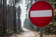 © Piotr - No entry road sign. Road markings standing by a forest road.
