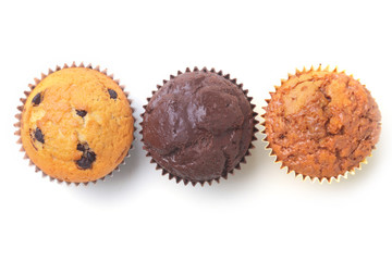 Assorted with Delicious homemade cupcakes with raisins and chocolate isolated on white background. Muffins. Top view.