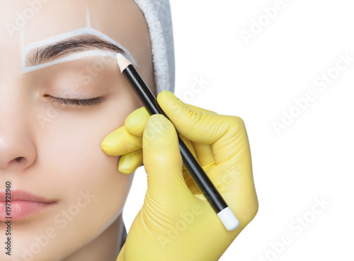 Fotografie, Obraz Permanent make-up for eyebrows of beautiful woman with thick brows in beauty salon