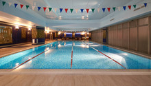 Interior Of Public Swimming Pool In A Luxury Fitness Gym.