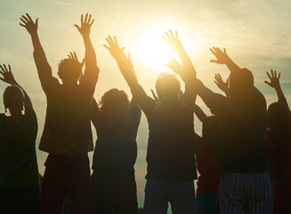 Wall Mural - Fans at open air concert, back view. Open-air rave party. Raising hands up.