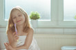 © spass - Portrait of pretty little child girl with white towel after shower  in bright bathroom