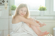 © spass - Portrait of pretty little child girl with white towel after shower  in bright bathroom