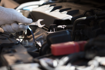 Mechanic repairing a car  in garage  Auto repair car engine, close u