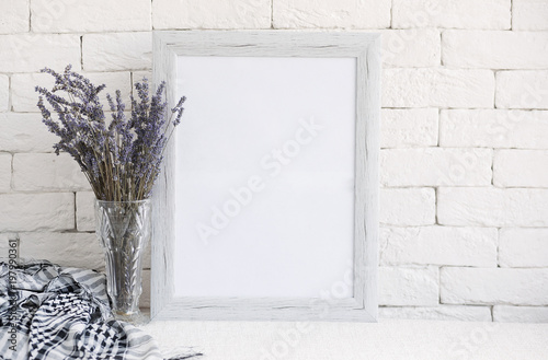 Fotografie, Obraz Provence. Lavender in a glass vase against a white brick wall.