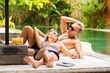 © Kaspars Grinvalds - Couple relaxing by the pool