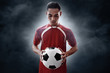 © fotokitas - Soccer player holding soccer ball