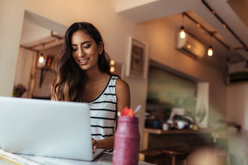 Woman working on laptop computer