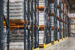 © Mint Images - Interior of a warehouse showing flavoured bottled water stored on pallets and set on large racks.