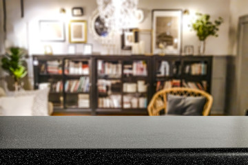 Wall Mural - empty table top with copy space for products against the background of a blurred bookcase in home in