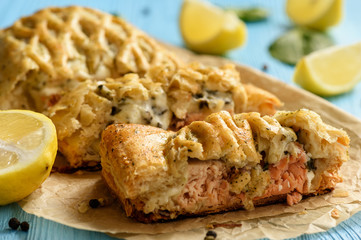 Wall Mural - Homemade baked salmon with spinach in puff pastry.