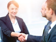 © ASDF - closeup of business woman shaking hands with her colleague.