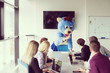 © .shock - boss dresed as bear having fun with business people in trendy office