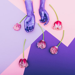 Wall Mural - pearly purple hands and tulips. ultra violet. pastel minimal. beautiful concept