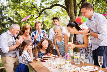 Wall Mural - Family celebration or a garden party outside in the backyard.