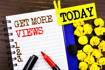 Poster - Word, writing, text  Get More Views. Business concept for More Traffic Leads Online Page Promotion Popularity Traffic written on notebook book paper on the wooden background Today