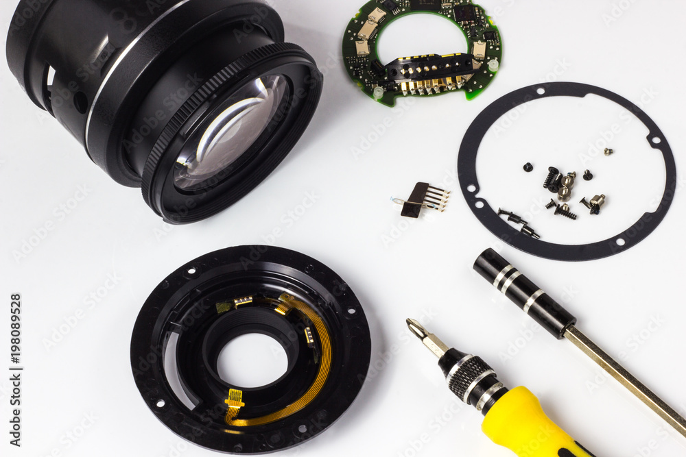 Disassembly and repair of a photo lens, cleaning the glass. Stock Photo ...