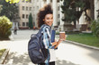 © Prostock-studio - African-american student with books at university