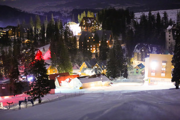 Sticker - Snowy mountain resort in evening. Winter vacation