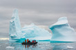 Zodiac cruising through icebergs, Antarctica