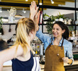 © Rawpixel.com - Women give a high five to each other