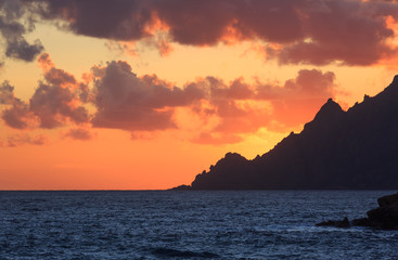 Fototapete - Clouds over the Mediterranean sea during sunset. Golf of Porto, Corsica, France.