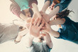 © Мария Кокулина - Happy friends putting their hands together.Focus on hands during a sunny day at camera.