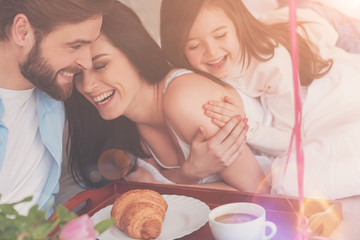 Wall Mural - Own little heaven. Tree loving sincere people hugging and expressing their joy while greeting mom on mothers day