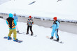 © Africa Studio - Group of friends taking snowboard lessons at snowy resort. Winter vacation