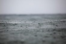 Rain Drops On The Surface Of The Waves