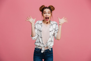 Wall Mural - Portrait of an excited young girl looking at camera