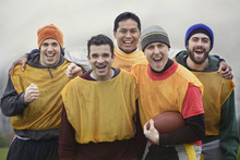 Mixed Race Group Of Men Who Play American Flag Football.