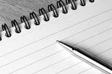 Paper Notepad And Pen Closeup In Black And White