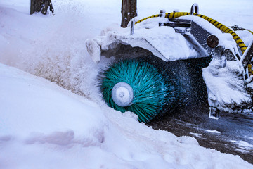 Snow-removing machine removes snow from city streets