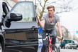 © Kzenon - Angry young bicyclist shouting while swerving for avoiding dangerous collision with the open door of a 4x4 car on a busy street in the city