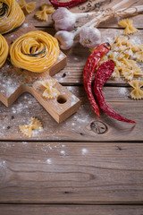 Wall Mural - Raw homemade pasta with flour, garlic and spices