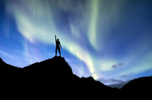 Silhouette Of A Winner On The Northen Light Backgroun. Concept And Idea Of Active Life
