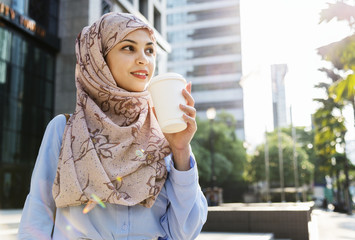 Sticker - Islamic woman drinking coffee in the city