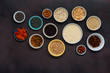 Set vegetarian healthy food - different superfood, seeds and cereal on dark background, top view. Flat lay. Clean eating concept