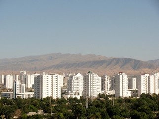 aerial view of high-rise office buildings residential and kopet dag mountain range ashgabat. turkmen