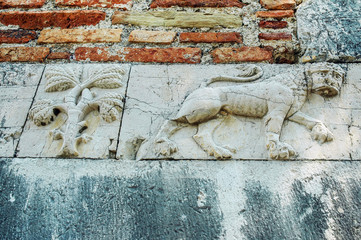 Wall Mural - Relief of a lion on ancient wall
