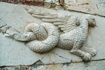 Wall Mural - Relief of a dragon on ancient wall