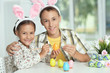 © aletia2011 - little brother and sister painting traditional Easter eggs