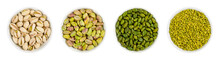 Pistachios In White Porcelain Bowls. Roasted Pistachio Seeds In Shells And Shelled. Green, Dried Fruits, Whole And Chopped. Pistacia Vera. Isolated Food Photo Close Up From Above On White Background.