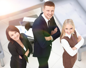 successful business team standing in office and looking at camera.