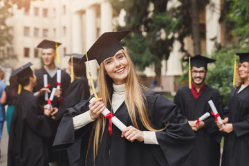 Poster - Happy young woman on her graduation day.