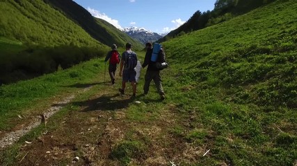 Wall Mural - young group hiking and chatting in the mountains of svaneti, georgia.